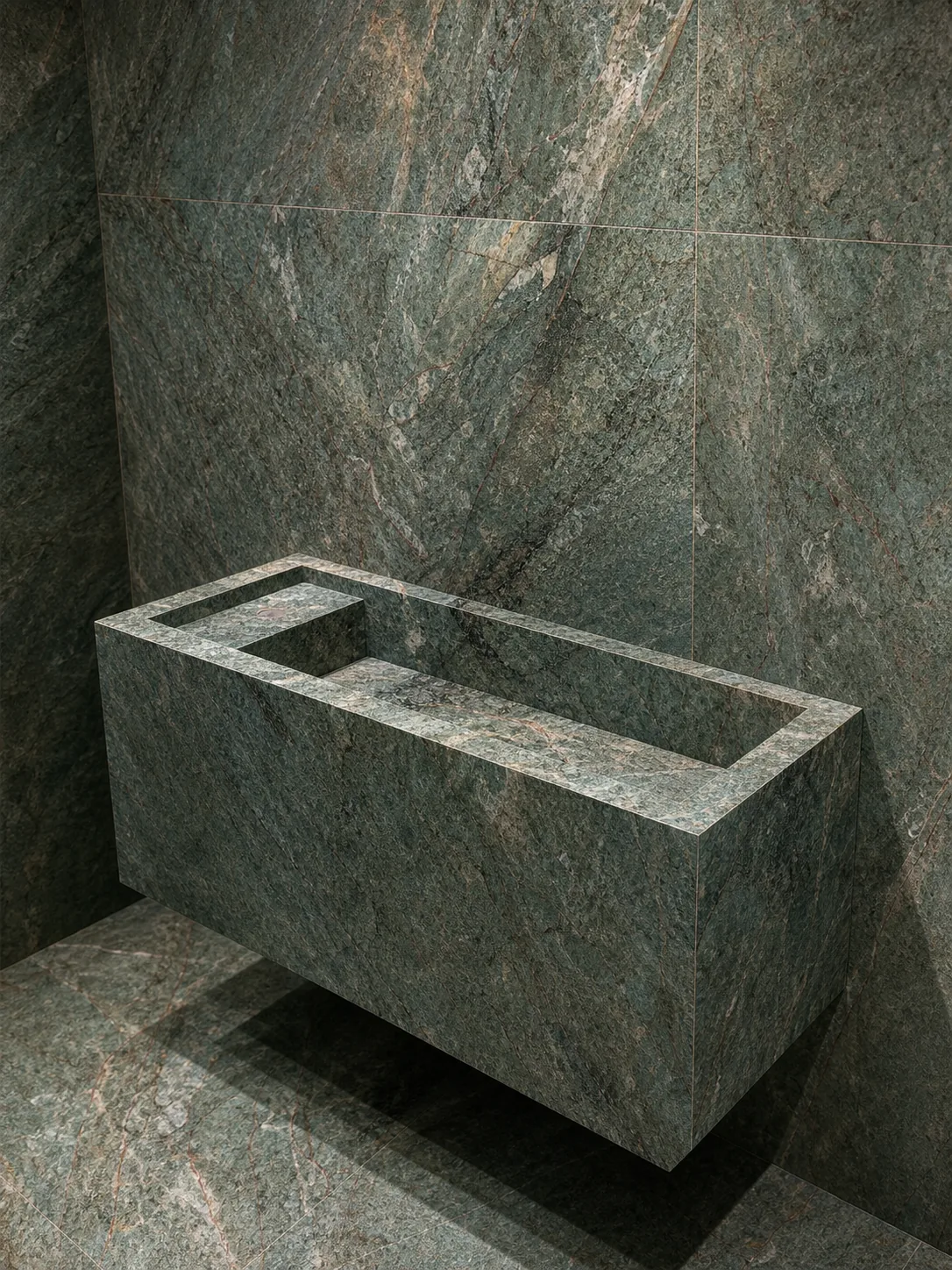 Green large-format porcelain feature wall and matching fabricated surface