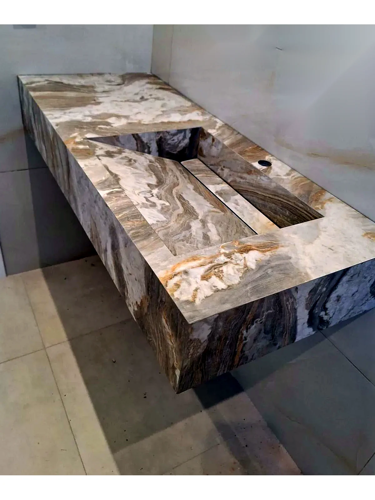 Mitred stone-effect porcelain sink with integrated basin and linear waste detail
