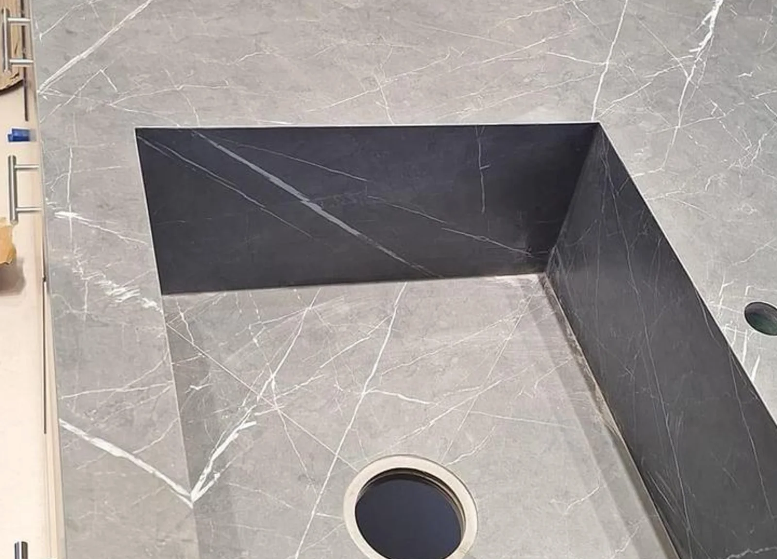 Porcelain basin base cut with its fall and circular waste opening before assembly