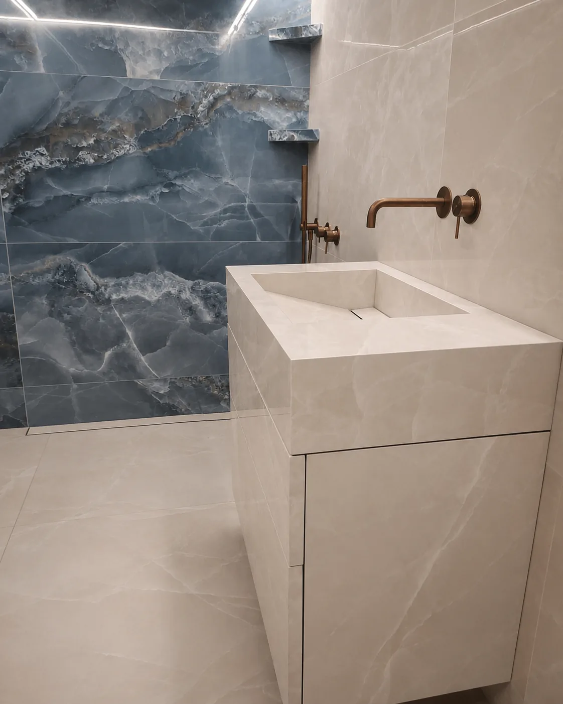 Completed mitred porcelain vanity with push-to-open drawers against a blue onyx-effect wall