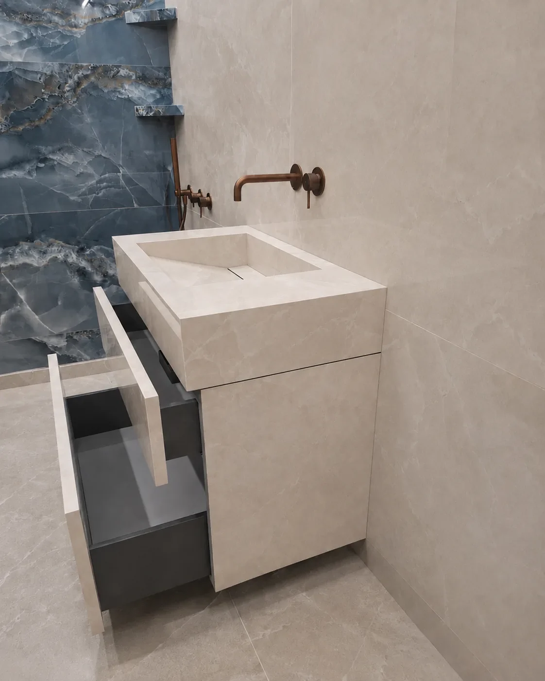 Side view of the porcelain sink vanity with both drawers open and no handles on the fronts.