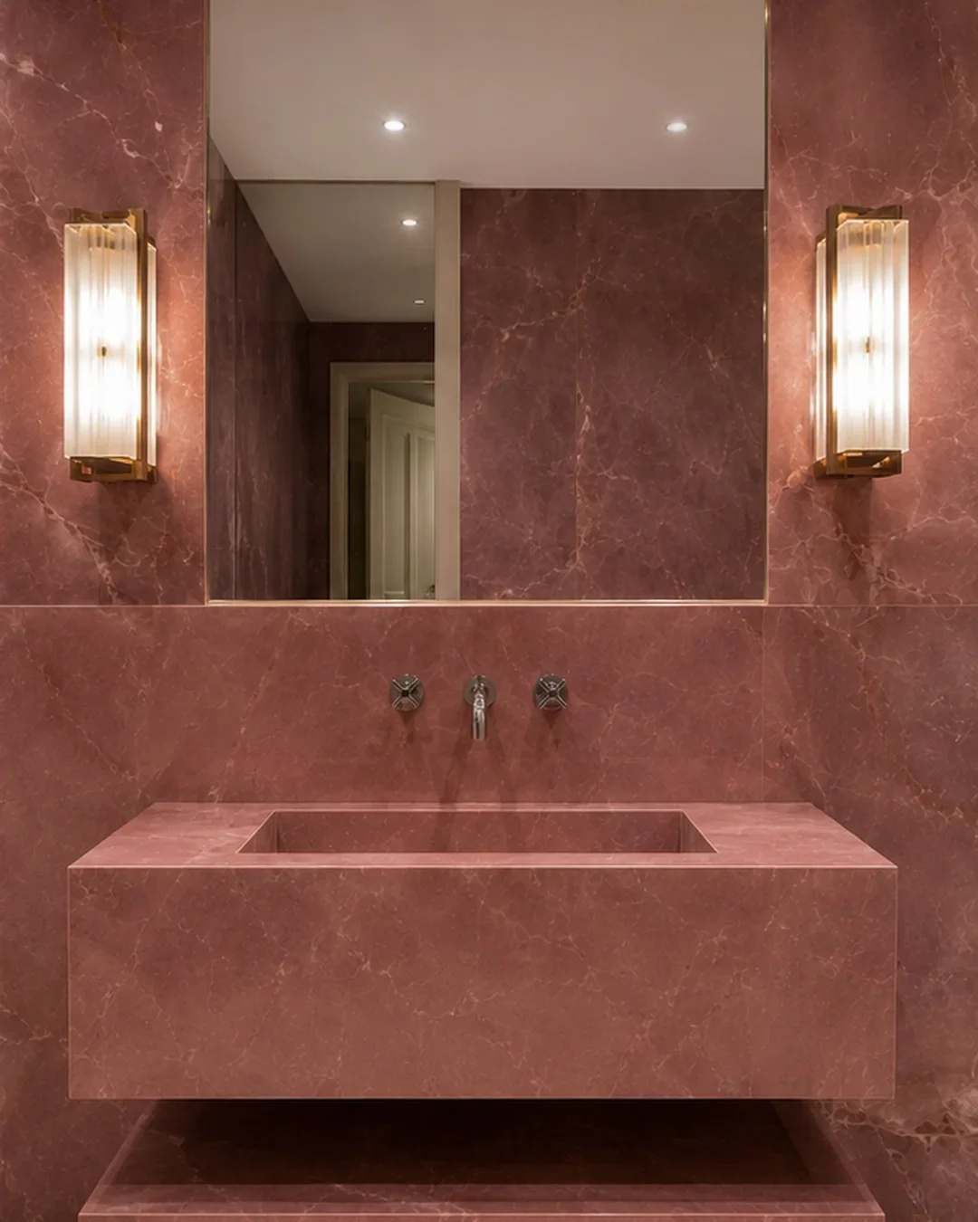 Large format porcelain bathroom tiling across two bathrooms.