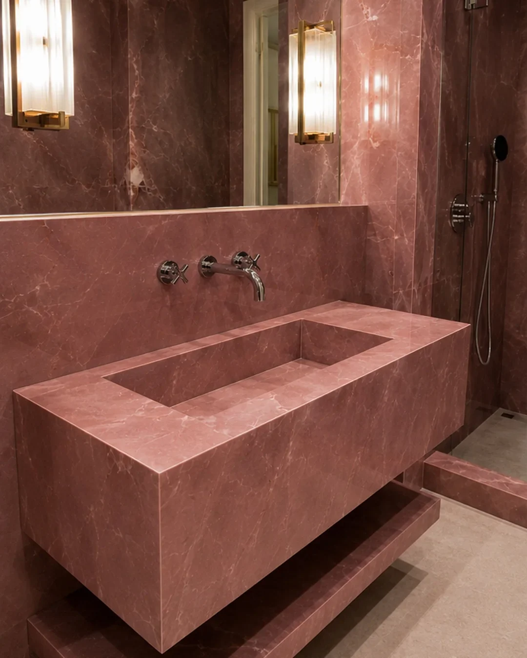 Rose onyx pattern large format porcelain bathroom with continuous wall surfaces.