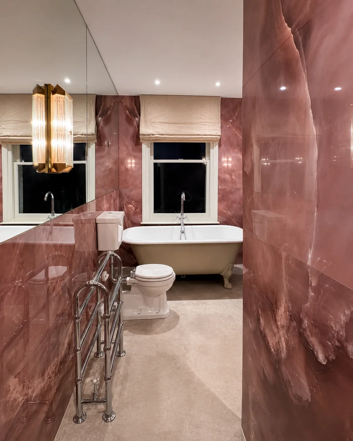 Large format 1600x3200 porcelain tiles installed in rose onyx pattern bathroom.