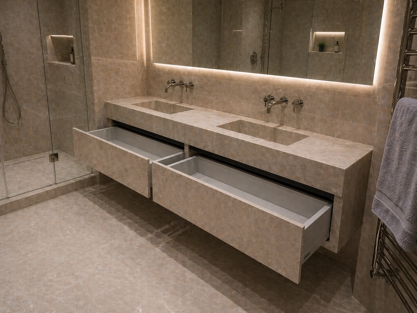 Angled view of the double vanity, open drawers and mitred porcelain edges