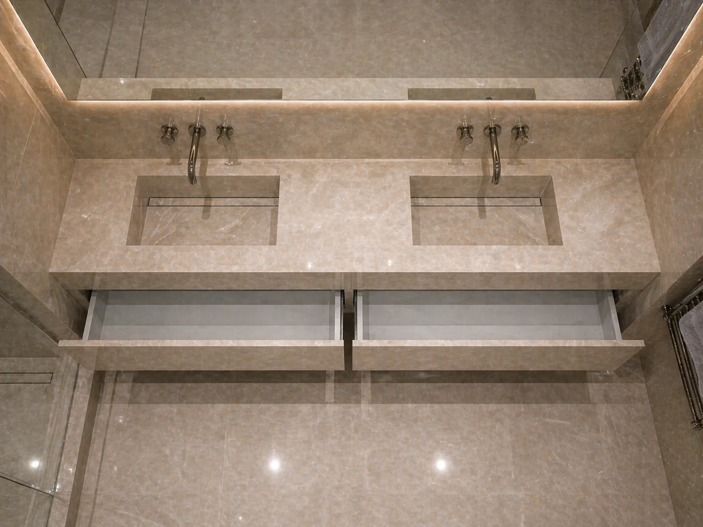 Overhead view of twin basins, taps mounted on the wall and open storage drawers